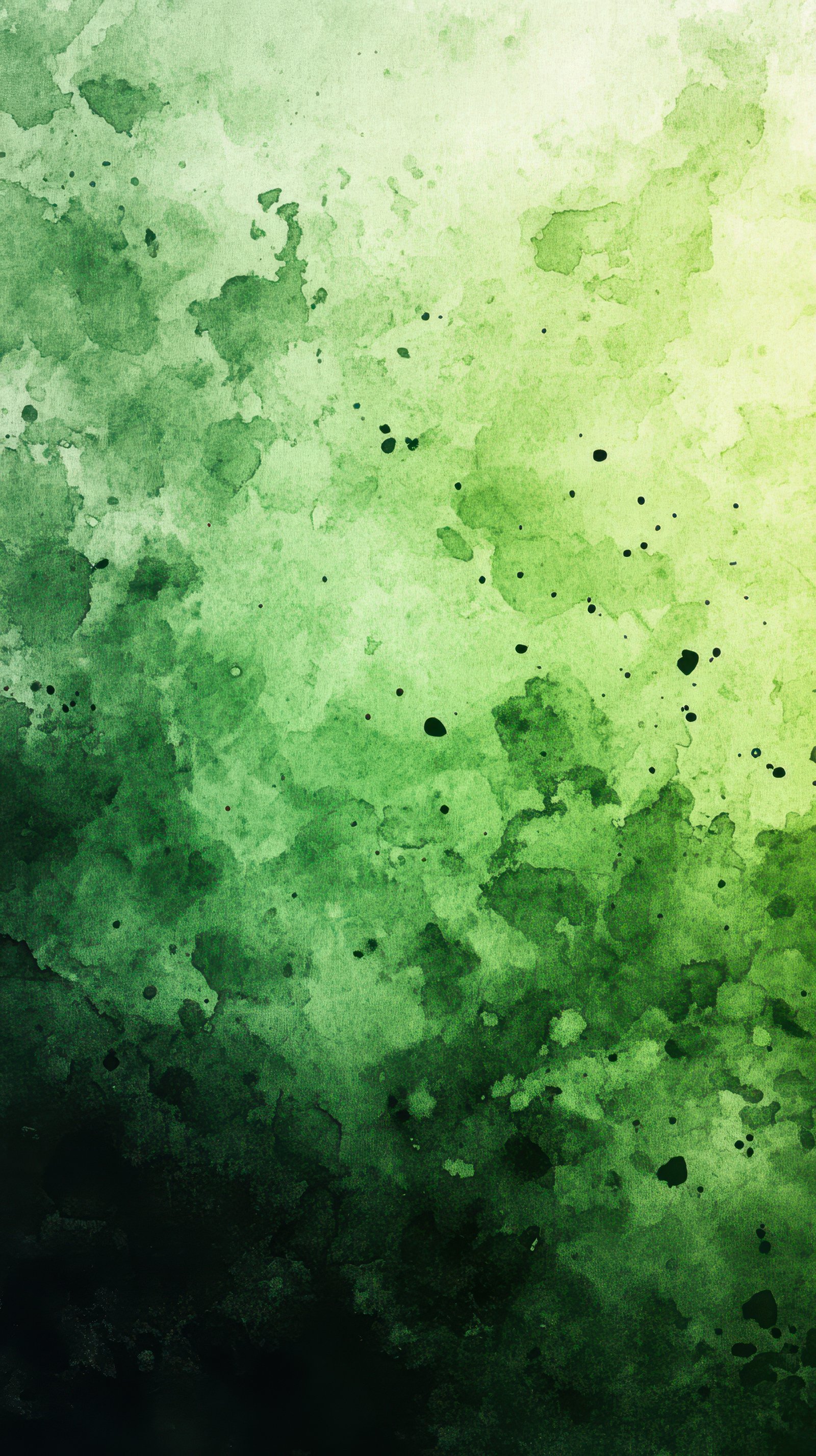 Abstract green watercolor pattern with gradient and splashes of color created in a creative studio environment